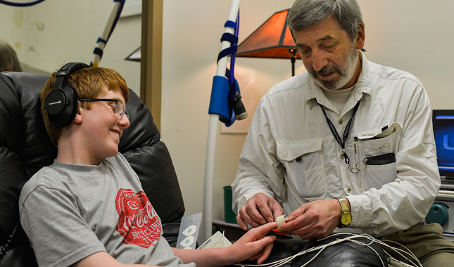 Charged connection: Electrophysiologist Estate Sokhadze (right) prepares Will Robeson for a session of TMS. William DeShazer