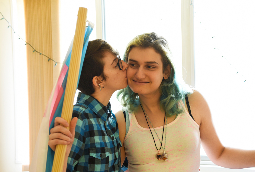 Close connection: Grobman, here with her partner Lane Balassie, is now a transgender rights activist. Many of her friends are also trans people with autism.