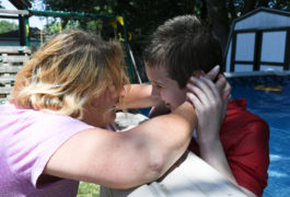 Debbie Cordone embraces her son, James, who she says benefited from intenseive behavioral therapy.