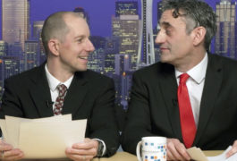 newscast scene, two men with documents