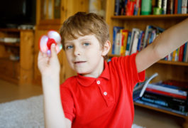 boy playing with a fidget spinner